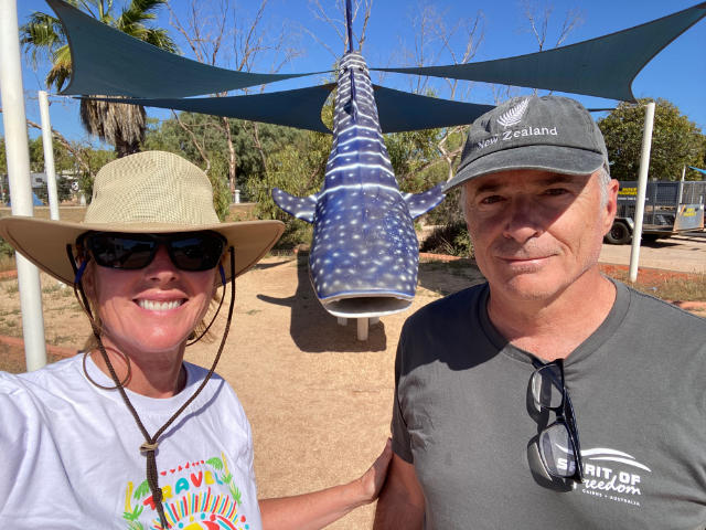 Pat and Glenn by a whale shark statue.